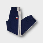 Nike navy blue track pants with contrast side stripes and embroidered logo patch
