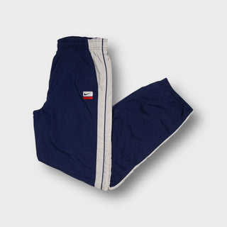 Nike navy blue track pants with contrast side stripes and embroidered logo patch