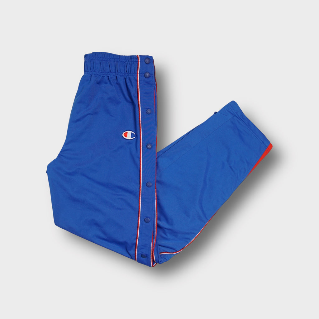 Blue Champion trackpants with side snap buttons and embroidered C logo