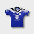 Adidas football jersey in blue with black and white graphic pattern and Minolta print.