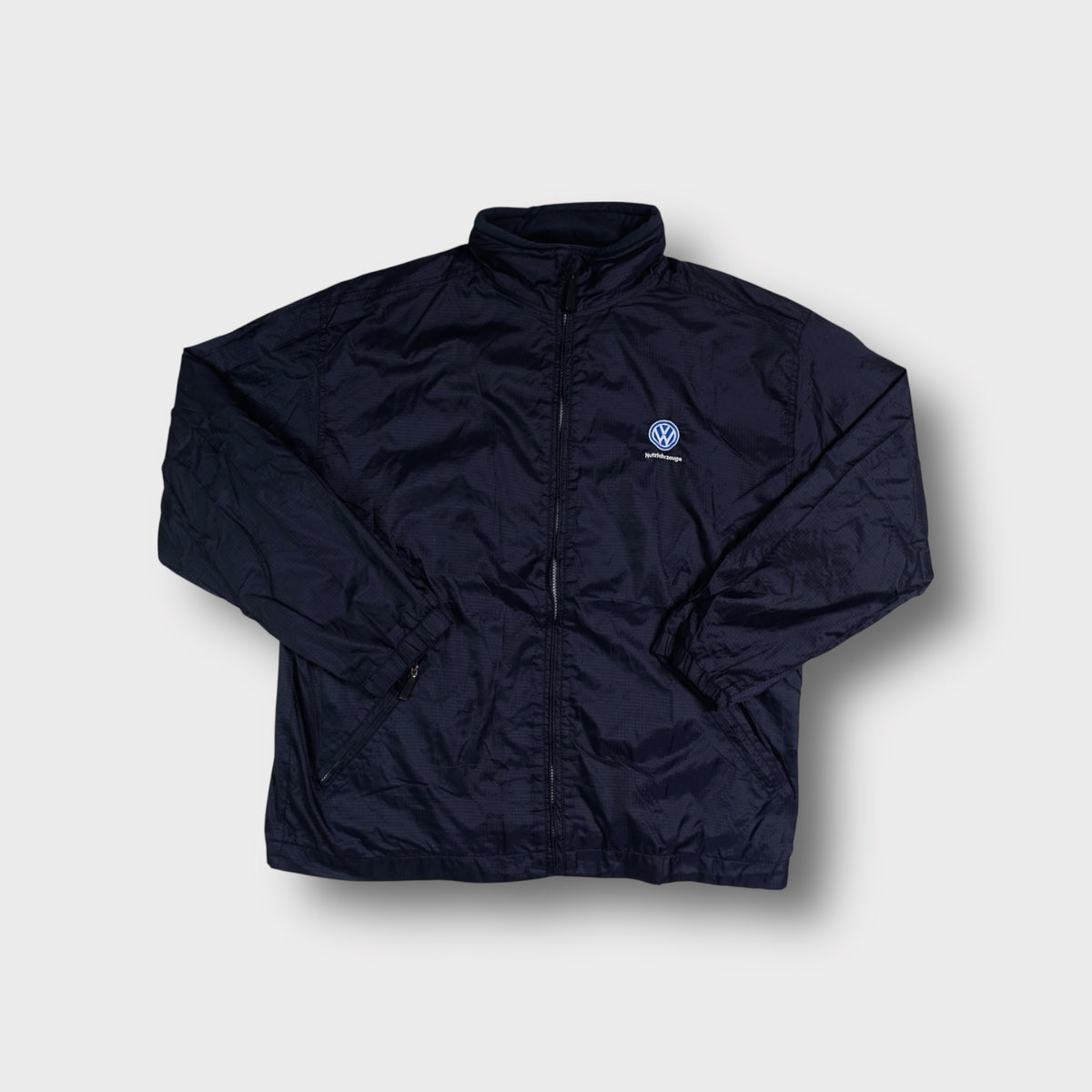 Jerzees full-zip jacket in navy blue with an embroidered Volkswagen Nutzfahrzeuge chest logo.