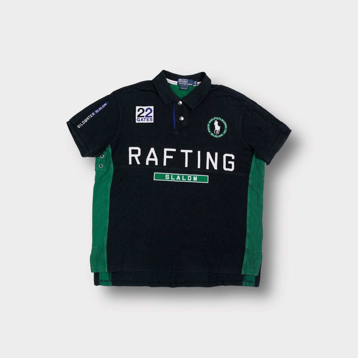 Ralph Lauren polo shirt in black with Rafting Slalom patches and green side panels