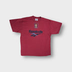 Red Reebok T-Shirt featuring an embroidered Aston Villa F.C. Crest and printed logo