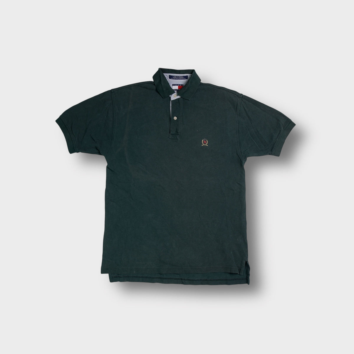 Tommy Hilfiger polo shirt in dark green with embroidered lion crest logo