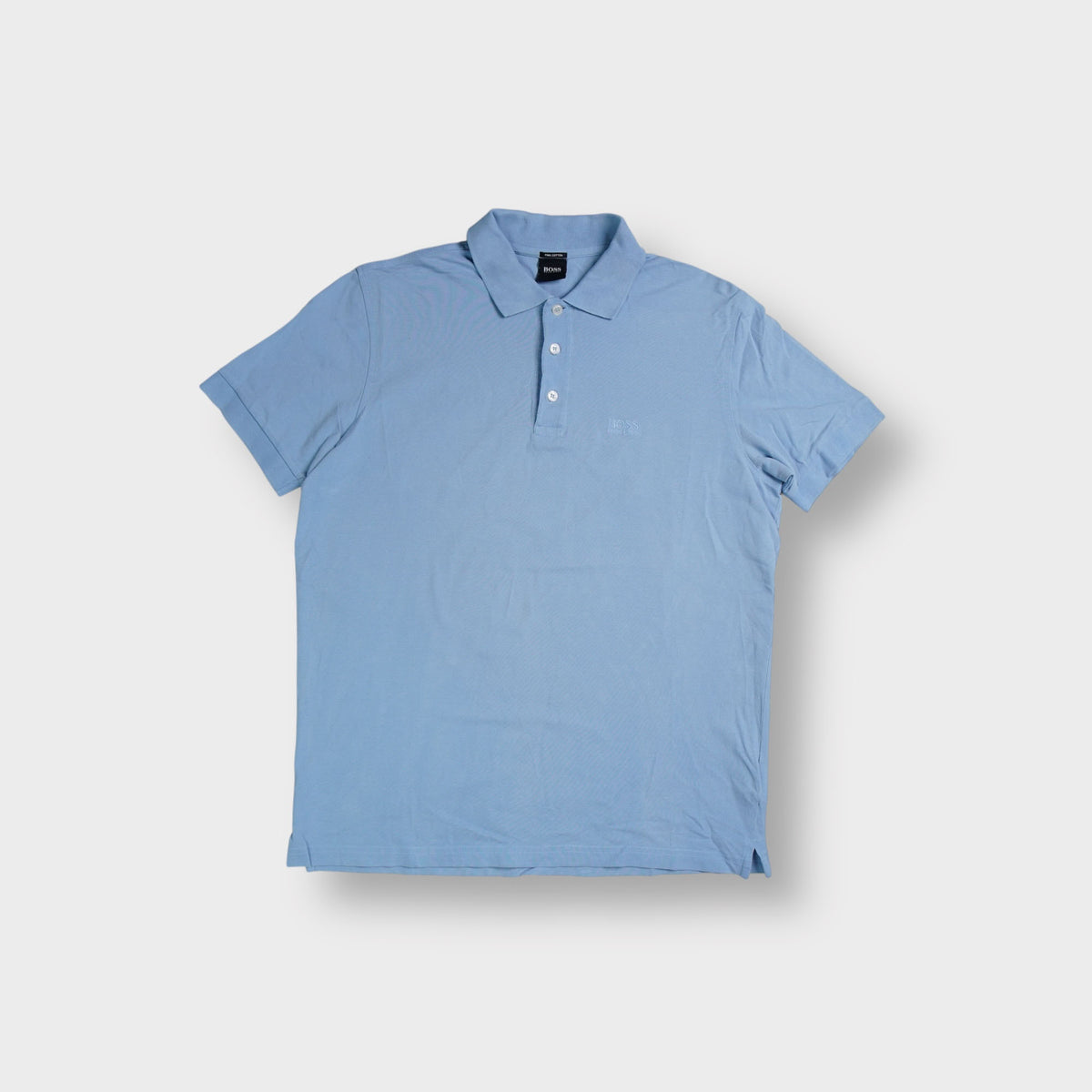 Hugo Boss blue polo shirt with tonal chest logo embroidery and three-button collar