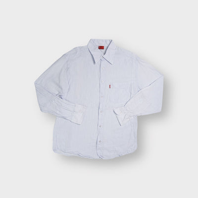 Levi's long sleeve shirt in light blue with a front chest pocket and red tab label.
