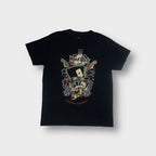 Hard Rock Cafe black T-Shirt featuring a front skull graphic with top hat and guitars.