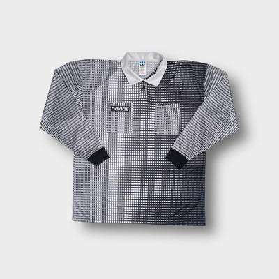 White Adidas long-sleeve referee jersey with a geometric grid print and collar