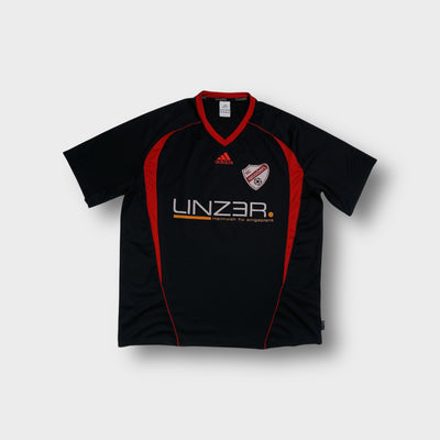 Adidas jersey in black featuring red V-neck collar, SC Neudörfl crest, and sponsor print