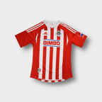 Adidas Deportivo Guadalajara shirt in white with red stripes and printed sponsor logos.