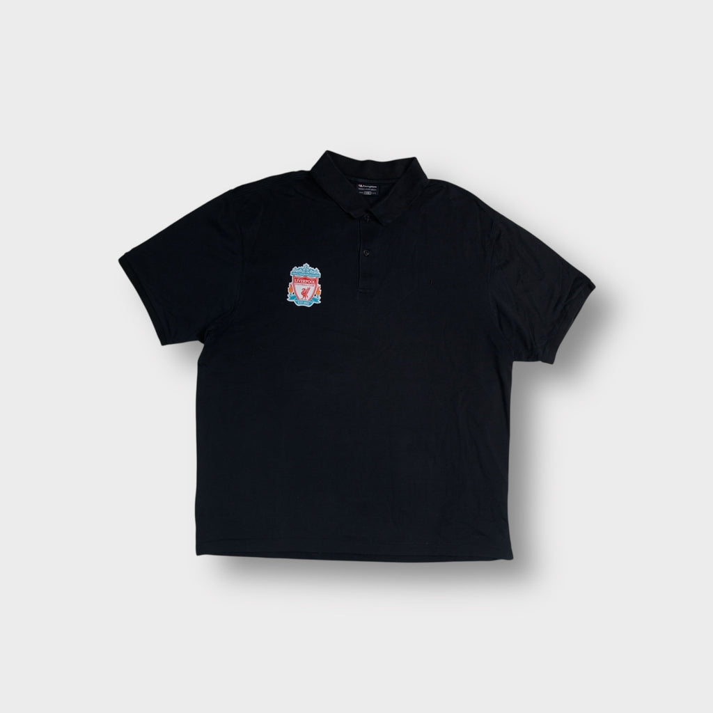Champion black polo shirt displaying an embroidered FC Liverpool crest on the chest