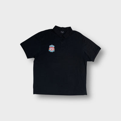 Champion black polo shirt displaying an embroidered FC Liverpool crest on the chest