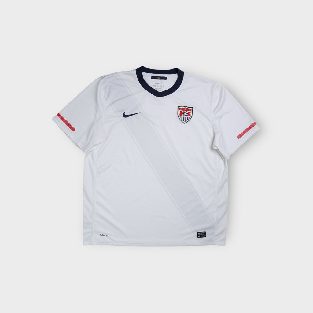 White Nike USA national football team jersey with embroidered crest and navy collar