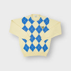 Lyle & Scott knit sweater in yellow featuring a blue argyle pattern and eagle logo.