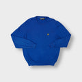 Lyle & Scott blue crew-neck sweater with an embroidered golden eagle on the chest.