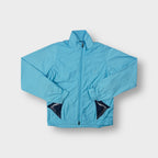 Nike lightweight track jacket in light blue with front zip and high collar