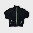 Nike jacket in black featuring a high collar and contrasting neon green zippers