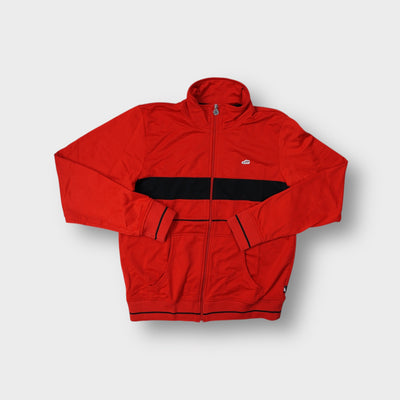 Nike track jacket in red featuring an embroidered sneaker patch and black chest band