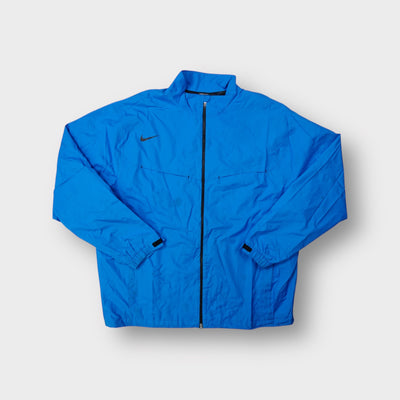 Blue Nike Golf full-zip jacket featuring a dark swoosh on the chest