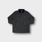 Dark grey Gant long-sleeve polo sweater with a dark blue collar and chest logo.