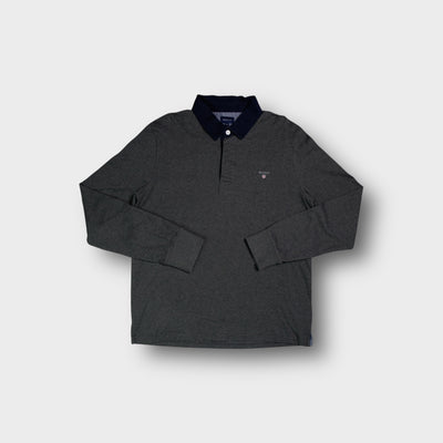 Dark grey Gant long-sleeve polo sweater with a dark blue collar and chest logo.