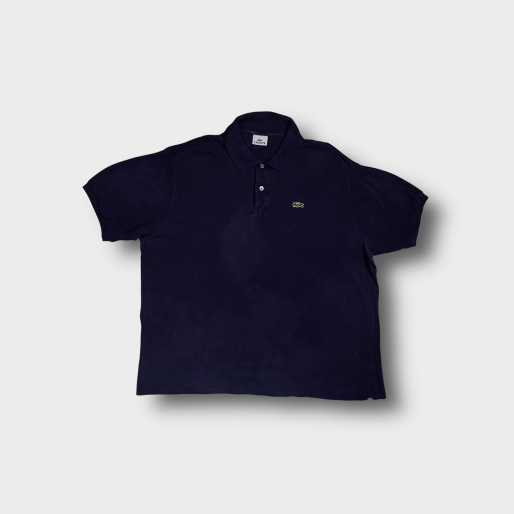 Lacoste polo shirt in navy blue featuring the embroidered crocodile logo patch on the chest