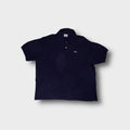 Lacoste polo shirt in navy blue featuring the embroidered crocodile logo patch on the chest