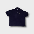 Lacoste polo shirt in navy blue featuring the embroidered crocodile logo patch on the chest