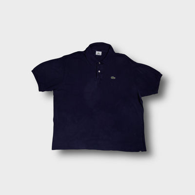 Lacoste polo shirt in navy blue featuring the embroidered crocodile logo patch on the chest