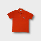 Red Lacoste polo shirt with striped trim details and embroidered crocodile logo patch