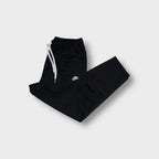Black Nike trackpants with white embroidered small logo and elastic drawstring waist