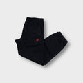 Nike black sweatpants with small red embroidered logo and Nike Air side print