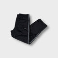 Nike trackpants in black with contrast side piping and an embroidered swoosh logo
