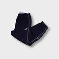Puma navy blue trackpants with white side piping and an embroidered cat logo
