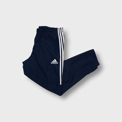 Blue Adidas FC Bayern trackpants with embroidered club crest and white side stripes
