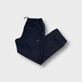 Adidas trackpants in navy blue with a small embroidered logo on the thigh