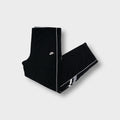 Nike trackpants in black with white side piping and embroidered swoosh logo