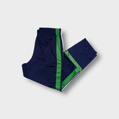 Adidas trackpants in navy blue with bright green side stripes and lower leg snap buttons