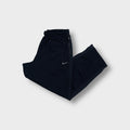 Nike trackpants in navy blue with a small embroidered white swoosh logo