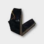 Sergio Tacchini trackpants in black with yellow drawstrings and side stripes