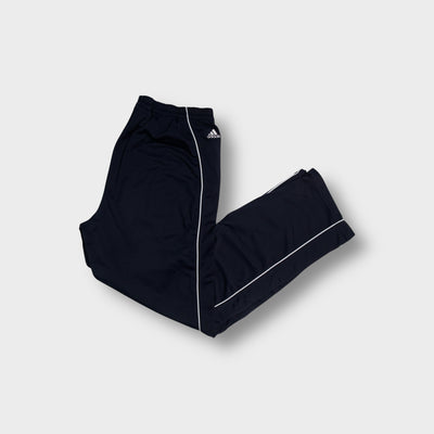 Adidas navy blue trackpants with contrasting white piping and an embroidered logo