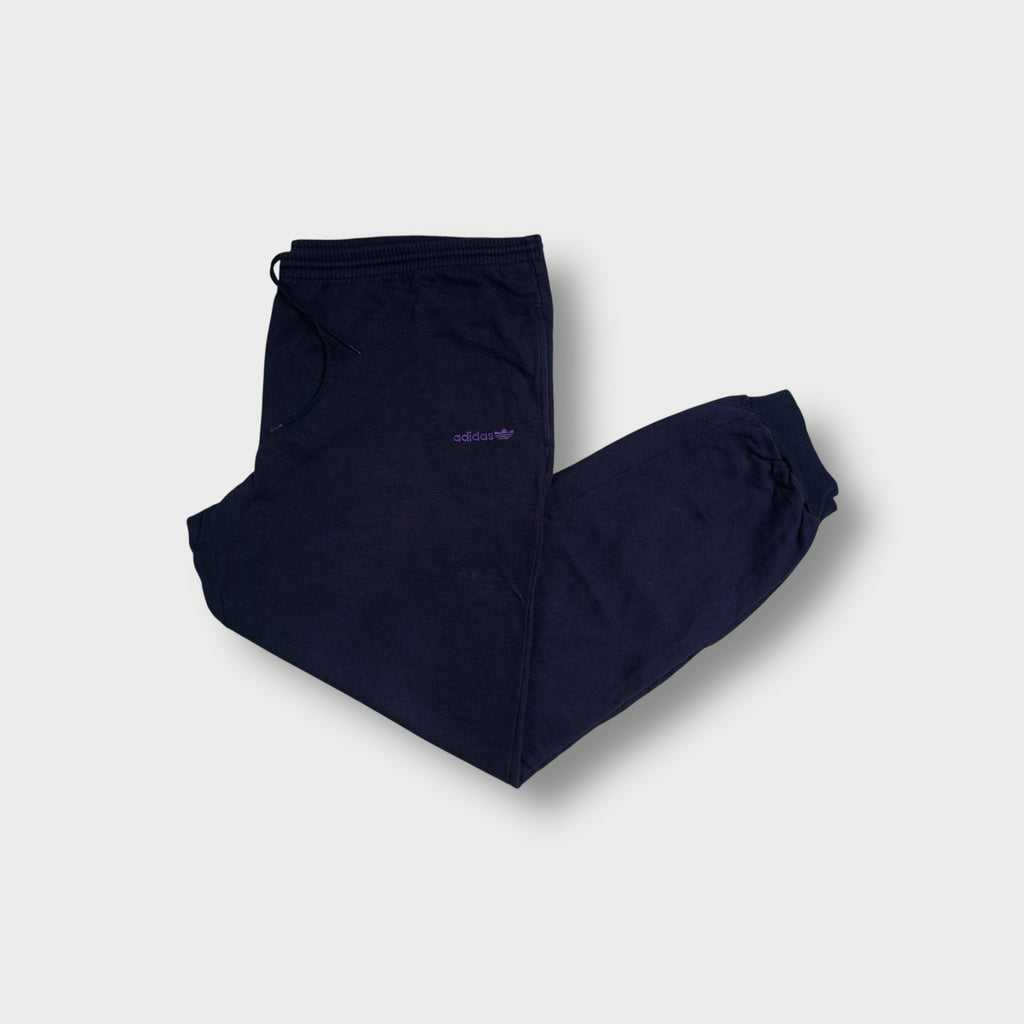 Adidas blue sweatpants with small purple embroidered trefoil logo