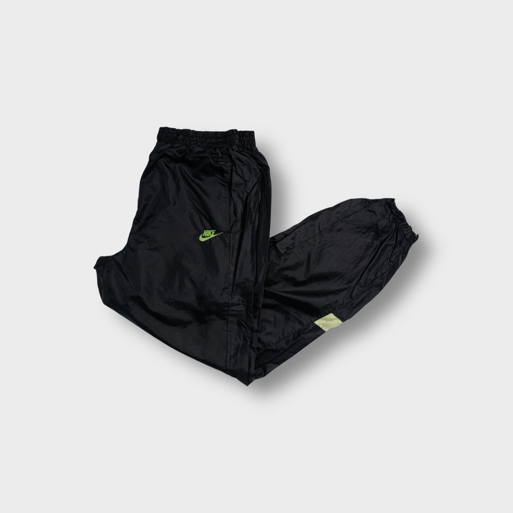 Black Nike trackpants with neon green embroidered logo and pink side panels