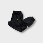 Black Nike trackpants with neon green embroidered logo and pink side panels