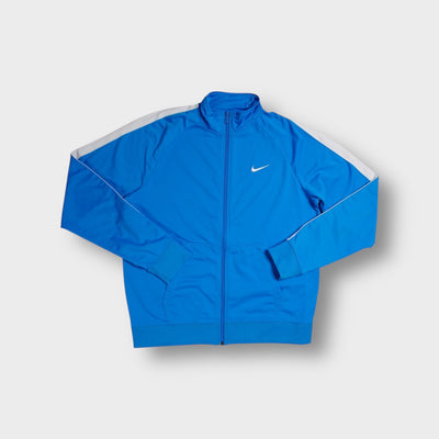 Blue Nike track jacket with white shoulder stripes and embroidered Swoosh logo