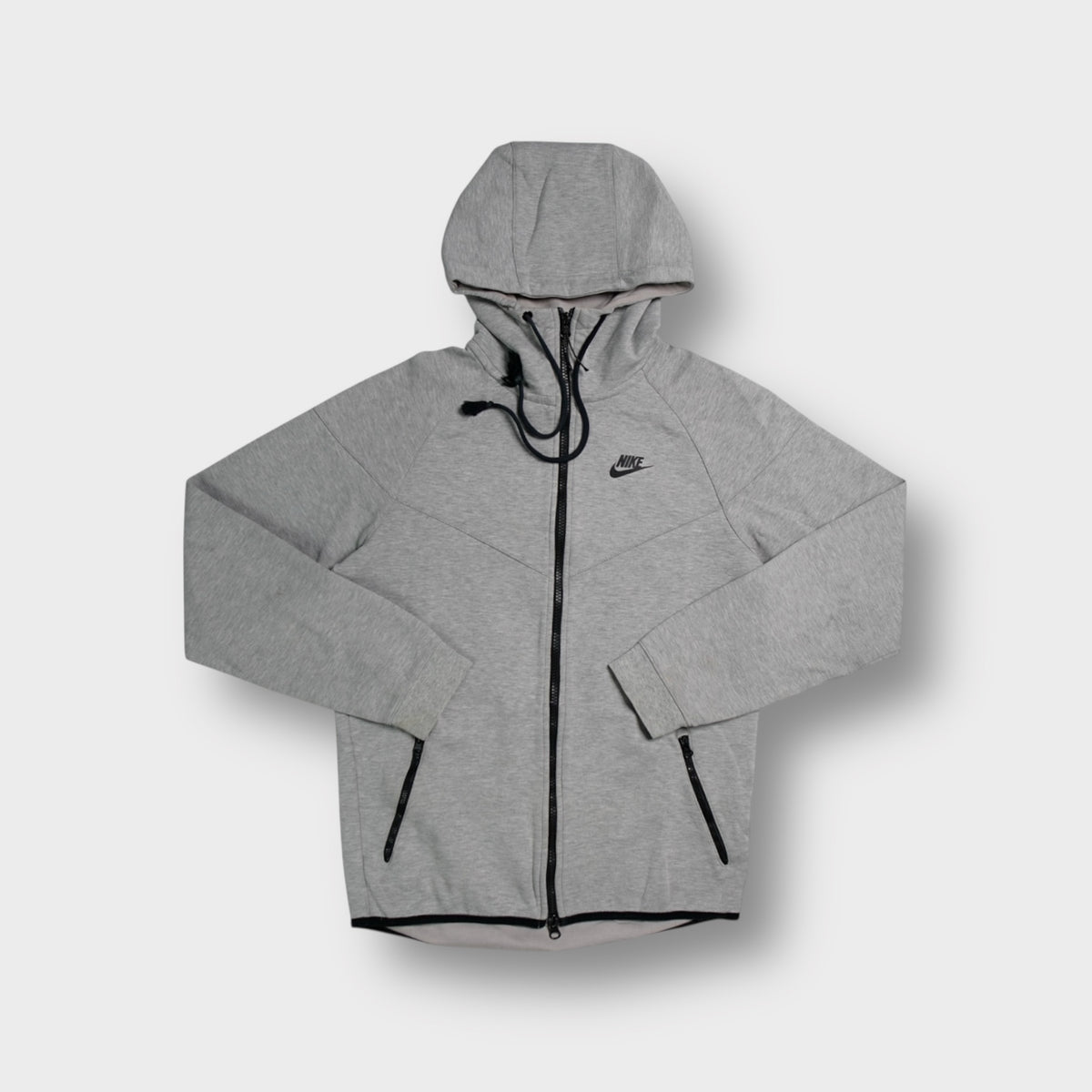 Grey Nike Tech zip-up hoodie with printed chest logo and high neck hood