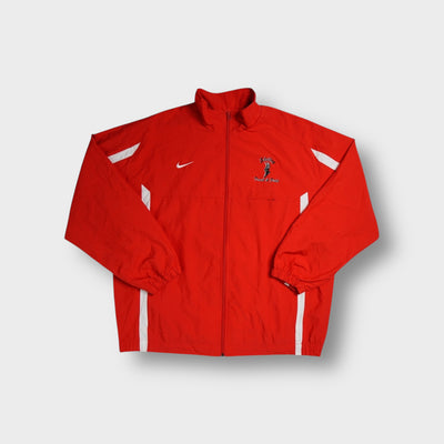 Nike track jacket in red with white swoosh and embroidered Shelby Track & Field chest logo