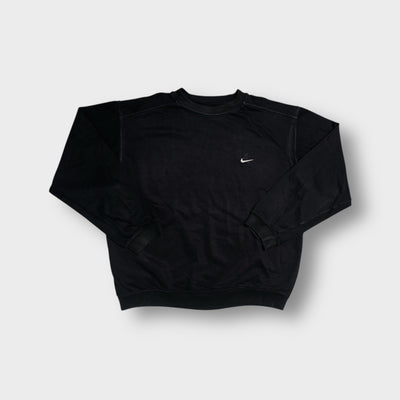 Nike sweater in black with a small white embroidered swoosh on the chest