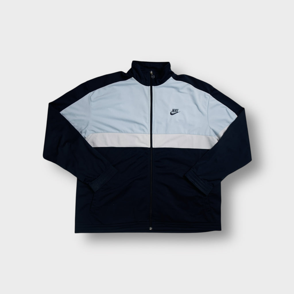 Nike track jacket in blue with light blue panel and embroidered chest logo