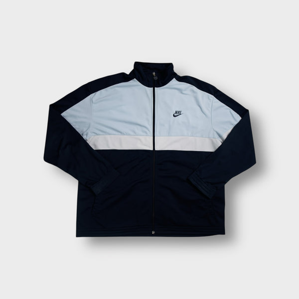 Nike track jacket in blue with light blue panel and embroidered chest logo